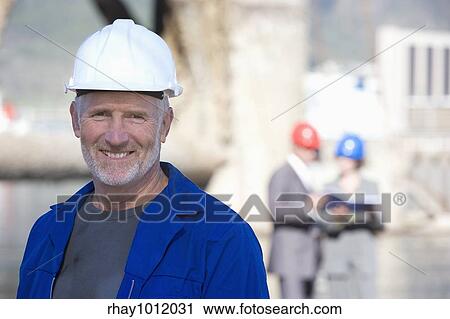 hard hats & heavy industry View Large Photo Image Stock Image - hard hats & heavy industry. Fotosearch
