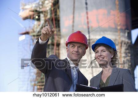 hard hats & heavy industry View Large Photo Image Stock Image - hard hats & heavy industry. Fotosearch