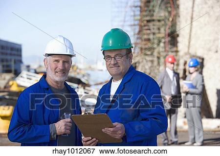 Stock Photo - hard hats & heavy industry. Fotosearch