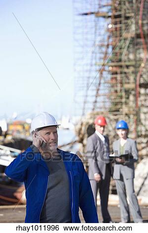 Stock Photograph - hard hats & heavy industry. Fotosearch