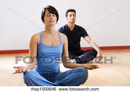 health club: man and women doing yoga. View Large Photo Image Stock Photograph - health club: man and women doing yoga.. Fotosearch