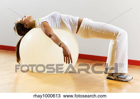 health club: woman doing stretching and aerobics View Large Photo Image Stock Image - health club: woman doing stretching and aerobics. Fotosearch