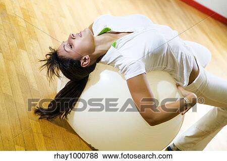 Stock Photo - health club: women doing stretching and aerobics. Fotosearch