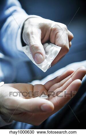 healthcare and medicine: man taking a painkiller View Large Photo Image Stock Image - healthcare and medicine: man taking a painkiller. Fotosearch