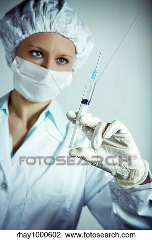 healthcare and medicine: nurse using a syringe View Large Photo Image Stock Image - healthcare and medicine: nurse using a syringe. Fotosearch