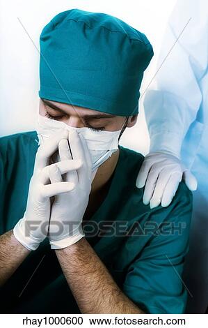 Stock Image - healthcare and medicine: surgeon after he failed an operation. Fotosearch