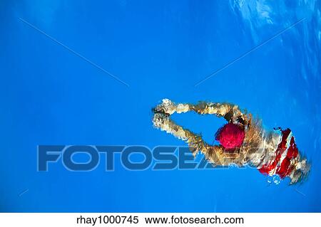 Stock Photography - Healthy lifestyle: this swimmer is winning the contest. Fotosearch