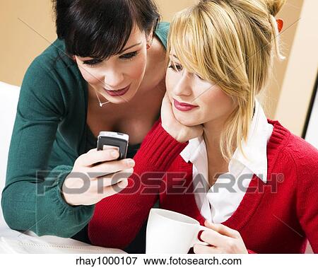 home life: friends talking on the phone View Large Photo Image Stock Photo - home life: friends talking on the phone. Fotosearch
