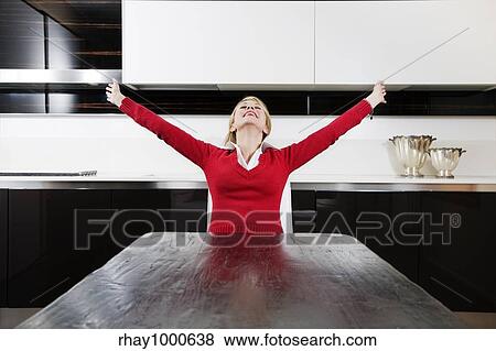Stock Photo - home life: woman enjoying her free time. Fotosearch