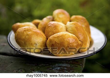 Hot fresh pies on an iron plate close upHot fresh pies on an iron plate close up View Large Photo Image Stock Photography - Hot fresh pies on an iron plate close upHot fresh pies on an iron plate close up. Fotosearch