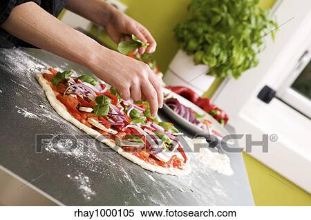 Italian style vegetarian pizza on the counter waiting to be baked. View Large Photo Image Stock Photography - Italian style vegetarian pizza on the counter waiting to be baked.. Fotosearch