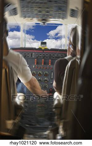 Jet Cockpit with Pilots and Clouds - motion added. View Large Photo Image Stock Image - Jet Cockpit with Pilots and Clouds - motion added.. Fotosearch
