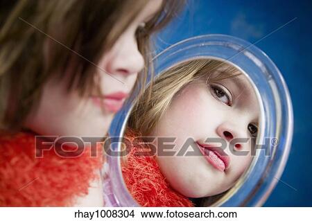 Little Girl Playing Dress-Up Looking in a Handheld Mirror View Large Photo Image Picture - Little Girl Playing Dress-Up Looking in a Handheld Mirror. Fotosearch