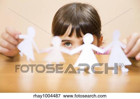 little girl playing with paper dolls View Large Photo Image Stock Photo - little girl playing with paper dolls. Fotosearch