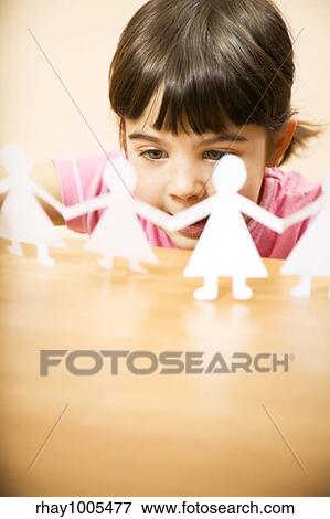 little girl playing with paper dolls View Large Photo Image Stock Photo - little girl playing with paper dolls. Fotosearch