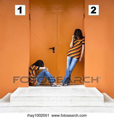 Loneliness woman and the other talking at the phone View Large Photo Image Stock Image - Loneliness woman and the other talking at the phone. Fotosearch