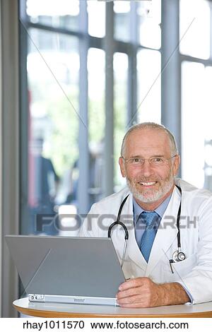 middle aged male doctor View Large Photo Image Stock Image - middle aged male doctor. Fotosearch