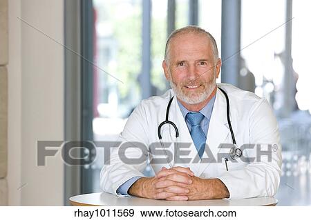 middle aged male doctor View Large Photo Image Stock Photo - middle aged male doctor. Fotosearch
