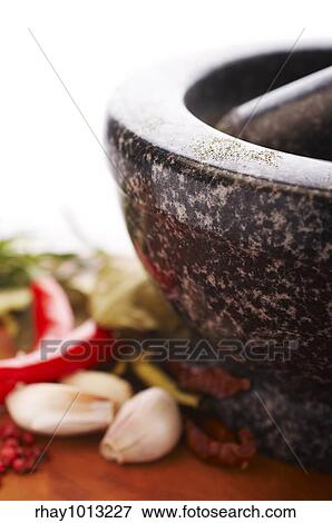 Stock Photo - "Mortar with thai spices (garlic, chili, pepper, lemon grass)". Fotosearch