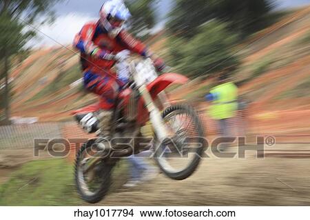 "Motorcross rider, abstract image created with intentional motion blur and zooming effect. " View Large Photo Image Picture - "Motorcross rider, abstract image created with intentional motion blur and zooming effect. ". Fotosearch