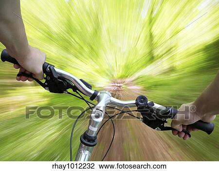 "Mountain biking down the trail, descending fast, subjective point of view" View Large Photo Image Stock Image - "Mountain biking down the trail, descending fast, subjective point of view". Fotosearch