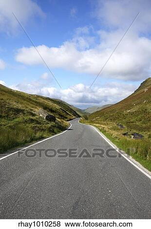 Narrow single lane country road in Wales UK. View Large Photo Image Stock Photo - Narrow single lane country road in Wales UK.. Fotosearch