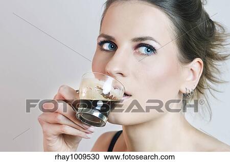 natural and fresh portrait of a young beautiful woman drinking espresso View Large Photo Image Stock Image - natural and fresh portrait of a young beautiful woman drinking espresso. Fotosearch
