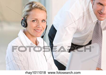 Stock Photo - office scene with telephonist. Fotosearch