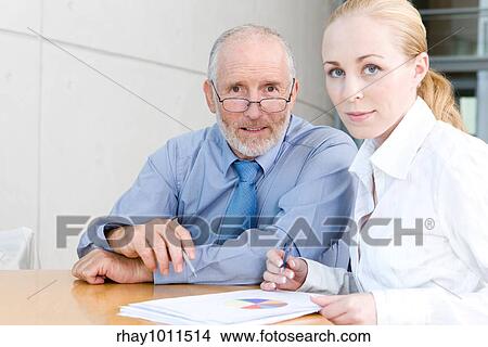 older businessman with female assistant View Large Photo Image Picture - older businessman with female assistant. Fotosearch