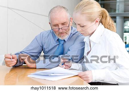older businessman with female assistant View Large Photo Image Stock Photo - older businessman with female assistant. Fotosearch
