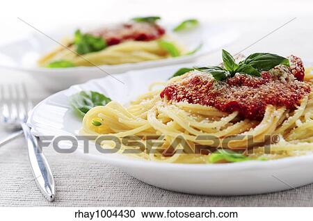 Pasta with tomato sauce basil and grated parmesan View Large Photo Image Stock Image - Pasta with tomato sauce basil and grated parmesan. Fotosearch