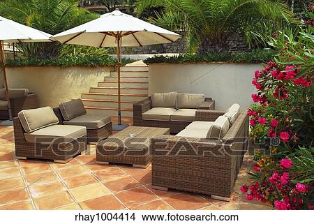 Patio of mediterranean villa in French Riviera with wicker furniture View Large Photo Image Picture - Patio of mediterranean villa in French Riviera with wicker furniture. Fotosearch