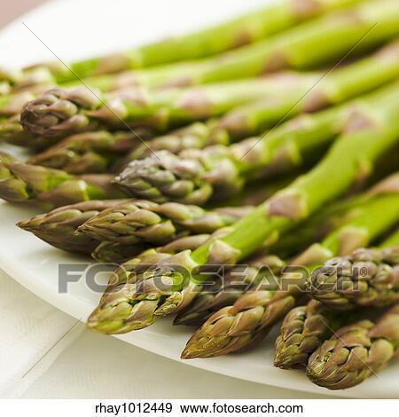 Stock Photo - Pile of asparagus on the kitchen table. Fotosearch