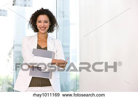 Stock Photo - portrait of a business woman standing. Fotosearch