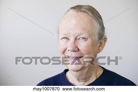 Stock Image - Portrait of a senior woman looking towards the camera.. Fotosearch