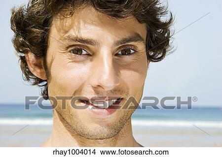 Portrait of a young man on the beach View Large Photo Image Picture - Portrait of a young man on the beach. Fotosearch