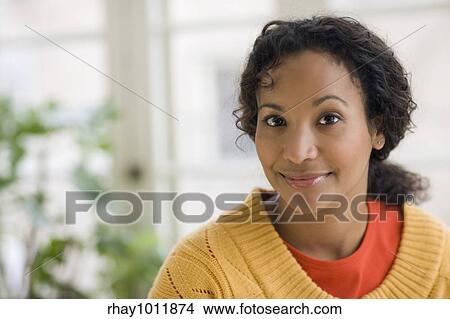 Portrait of a young smiling beautiful African American woman View Large Photo Image Picture - Portrait of a young smiling beautiful African American woman. Fotosearch
