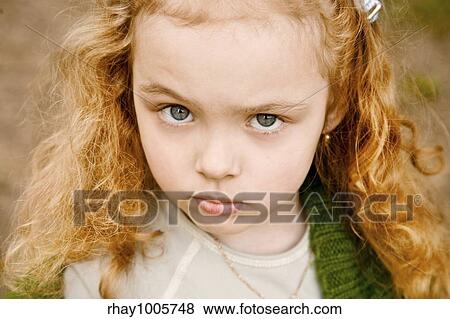 "Portrait of the serious grey-eyed little girl with the long hair, looking in a shotPortrait of the serious grey-eyed little girl with the long hair, looking in a shot" View Large Photo Image Stock Photo - "Portrait of the serious grey-eyed little girl with the long hair, looking in a shotPortrait of the serious grey-eyed little girl with the long hair, looking in a shot". Fotosearch