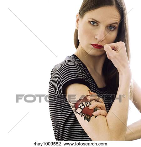proud daughter demonstrating her tattoo View Large Photo Image Stock Image - proud daughter demonstrating her tattoo. Fotosearch