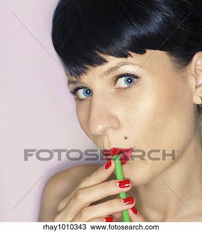 rockabilly girl drinking milkshake/drink with a straw View Large Photo Image Stock Image - rockabilly girl drinking milkshake/drink with a straw. Fotosearch