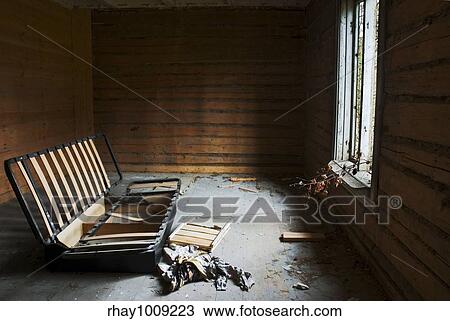 room in abandoned house with broken window and leftovers of a sofa View Large Photo Image Stock Image - room in abandoned house with broken window and leftovers of a sofa. Fotosearch