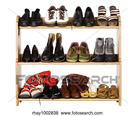 "Shoes, gym shoes, boots and other footwear stand on a rackShoes, gym shoes, boots and other footwear stand on a rack" View Large Photo Image Stock Photo - "Shoes, gym shoes, boots and other footwear stand on a rackShoes, gym shoes, boots and other footwear stand on a rack". Fotosearch