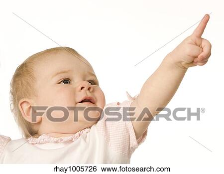 Small nice girl shows a finger upwards on a white backgroundSmall nice girl shows a finger upwards on a white background View Large Photo Image Stock Photograph - Small nice girl shows a finger upwards on a white backgroundSmall nice girl shows a finger upwards on a white background. Fotosearch