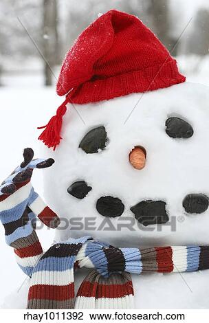 Smiley face snowman with a red hat View Large Photo Image Stock Image - Smiley face snowman with a red hat. Fotosearch