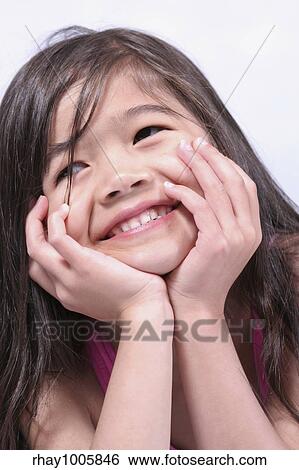 "Smiling girl relaxing on tummy, part Scandinavian-Thai background" View Large Photo Image Stock Photograph - "Smiling girl relaxing on tummy, part Scandinavian-Thai background". Fotosearch