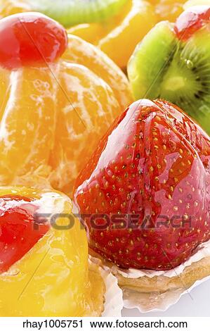 Stock Image - Some the various cakes decorated with berries and fruit close upSome the various cakes decorated with berries and fruit close up. Fotosearch
