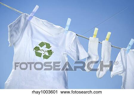 T-shirt with recycle logo drying on clothesline on a summer day View Large Photo Image Stock Image - T-shirt with recycle logo drying on clothesline on a summer day. Fotosearch
