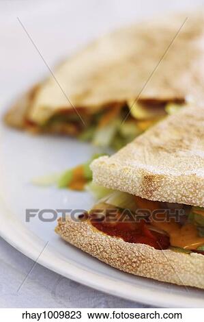 Stock Image - tasty pizza bread wraps with fresh stuffing. Fotosearch