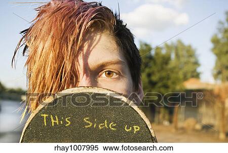 Teenage boy skateboarder with his board. View Large Photo Image Stock Photography - Teenage boy skateboarder with his board.. Fotosearch
