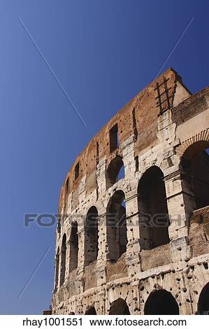 The Roman Colosseum viewed from the outside against a strong and clear blue sky View Large Photo Image Stock Image - The Roman Colosseum viewed from the outside against a strong and clear blue sky. Fotosearch